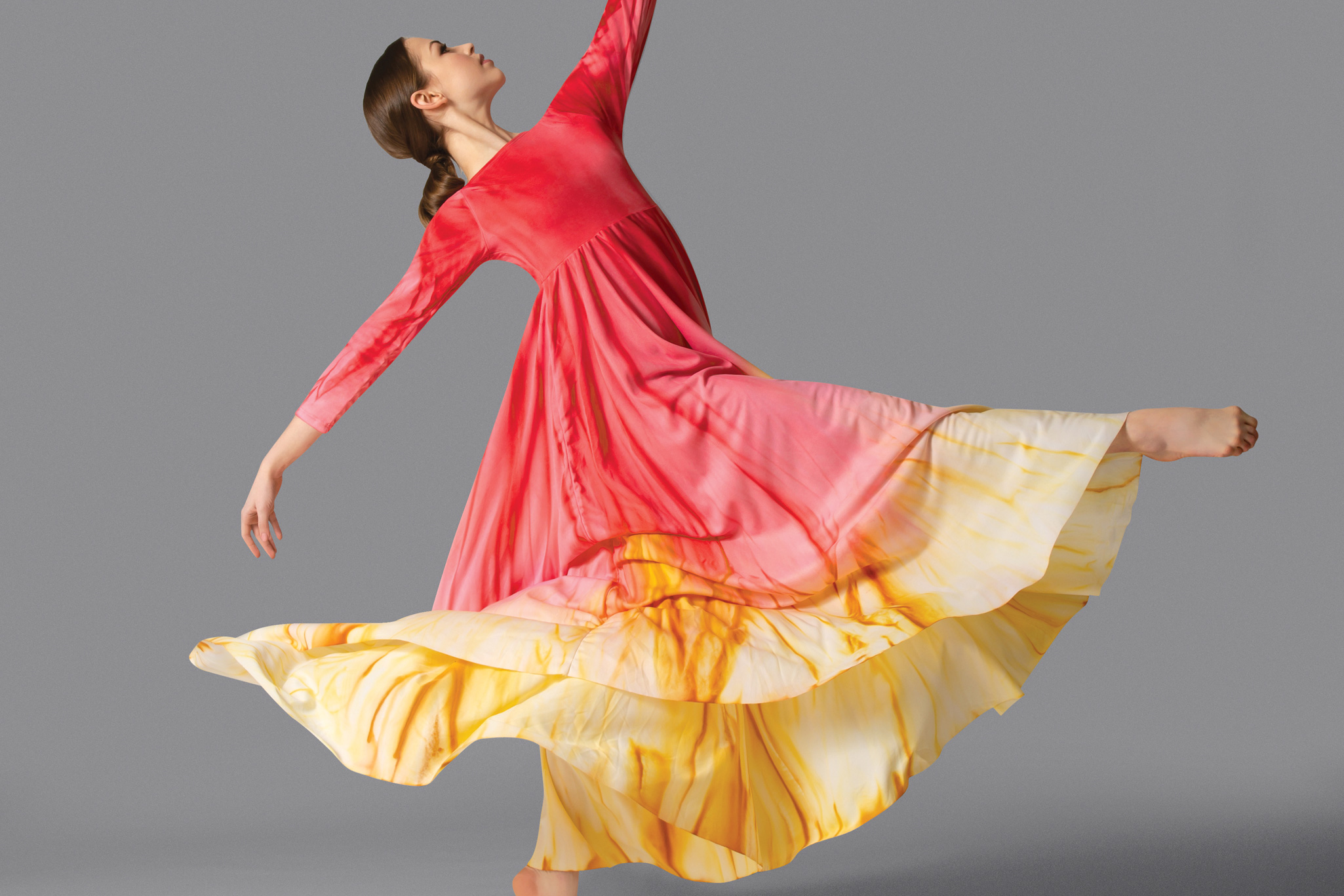 Image of a dancer at the beach wearing a Watercolour brand outfit.